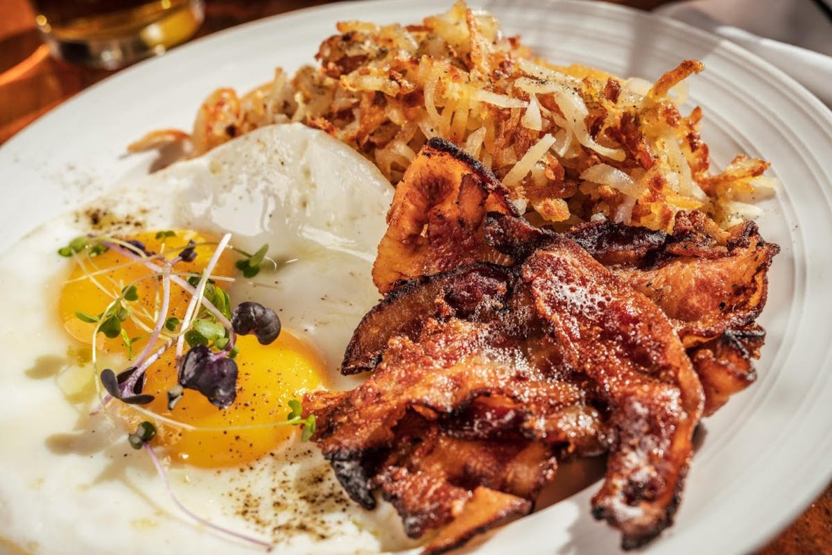 Grilled bacon, fried eggs and cheese